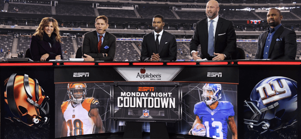 The ESPN MNF panel at the broadcast desk.