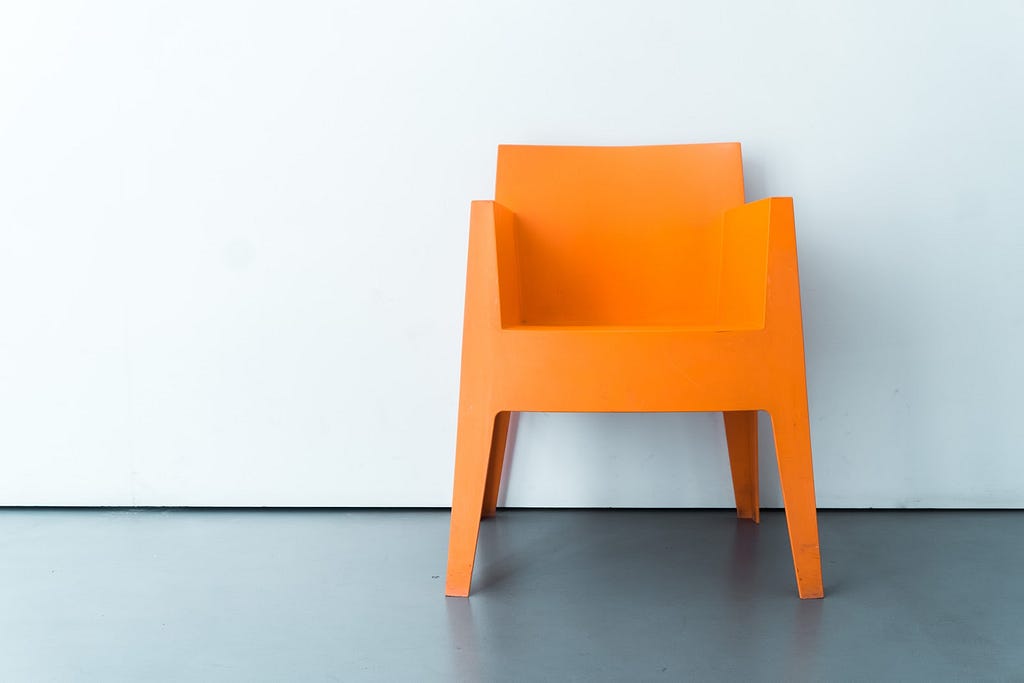 A minimal chair featuring linear, geometric lines