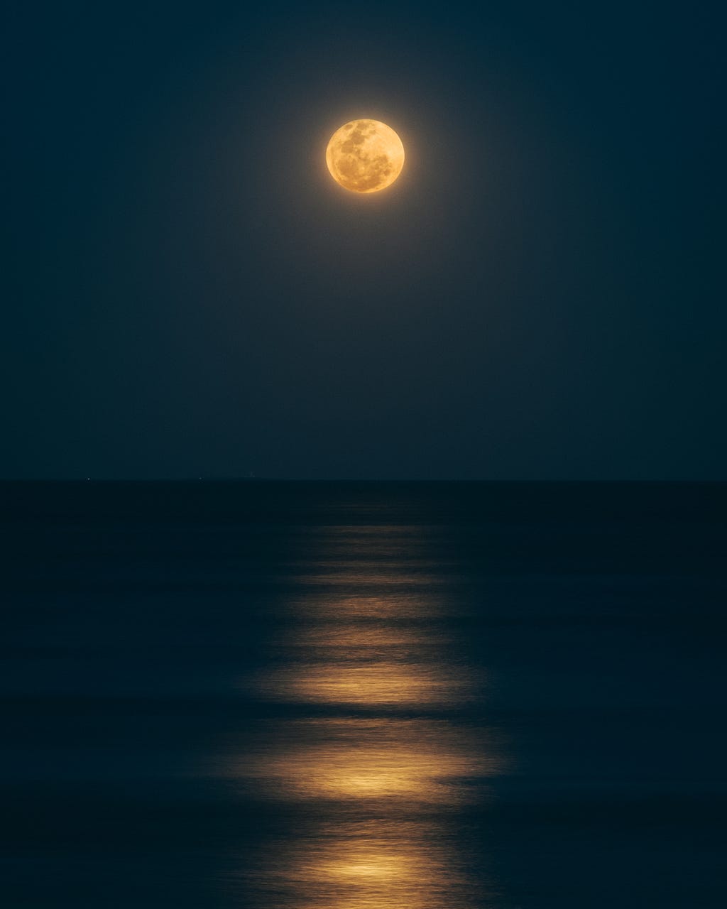 full moon over dark sea