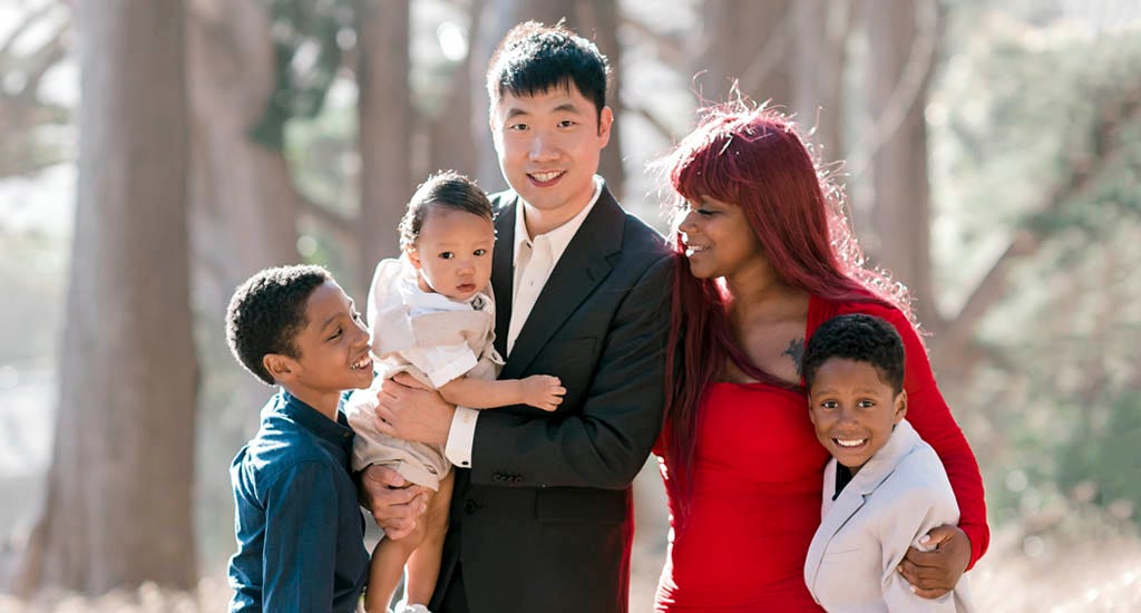 The Bright App cofounders James Zhang and Nerissa Zhang standing with their family