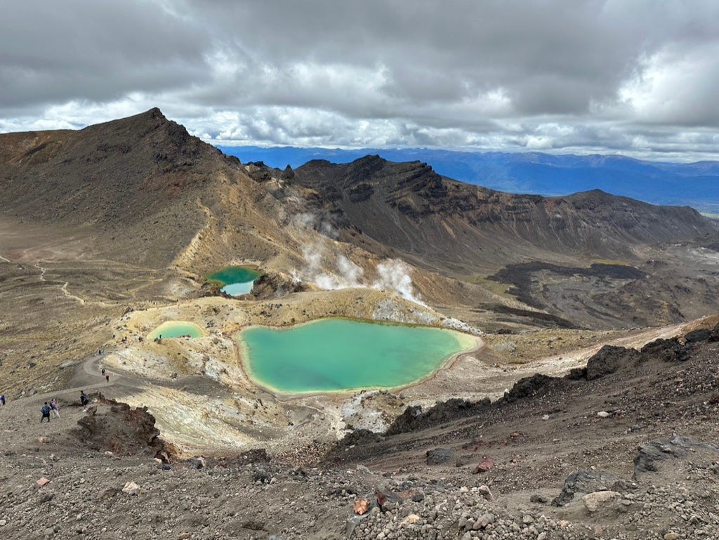 Emerald volcanic lakes with hills.