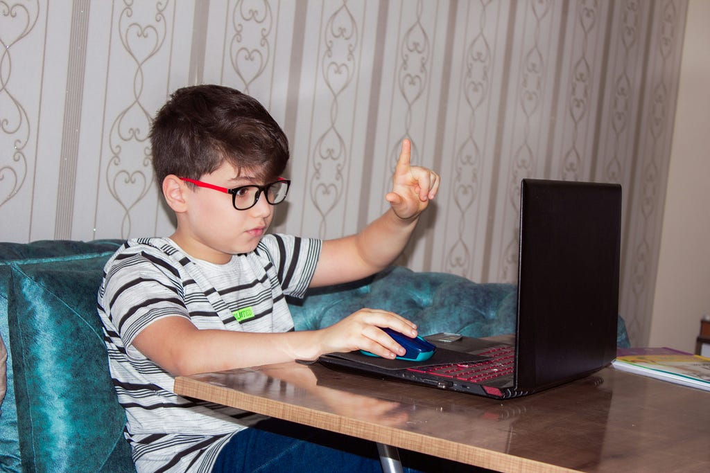 A child who is playing video games.