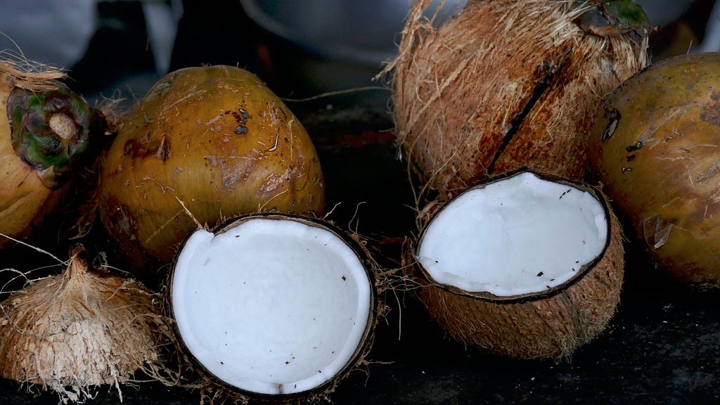 Coconuts with a broke opened pair of Coconuts