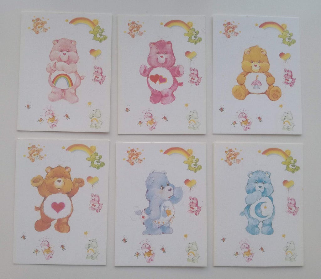 Original ‘Care Bears’ greatings cards — watercolour, colourful and featuring cuddly teddy-bears with symbols on their tummies, like hearts and moons.