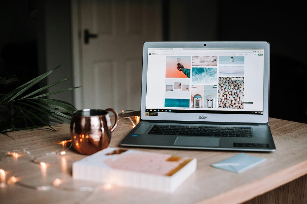 a laptop on a wooden table