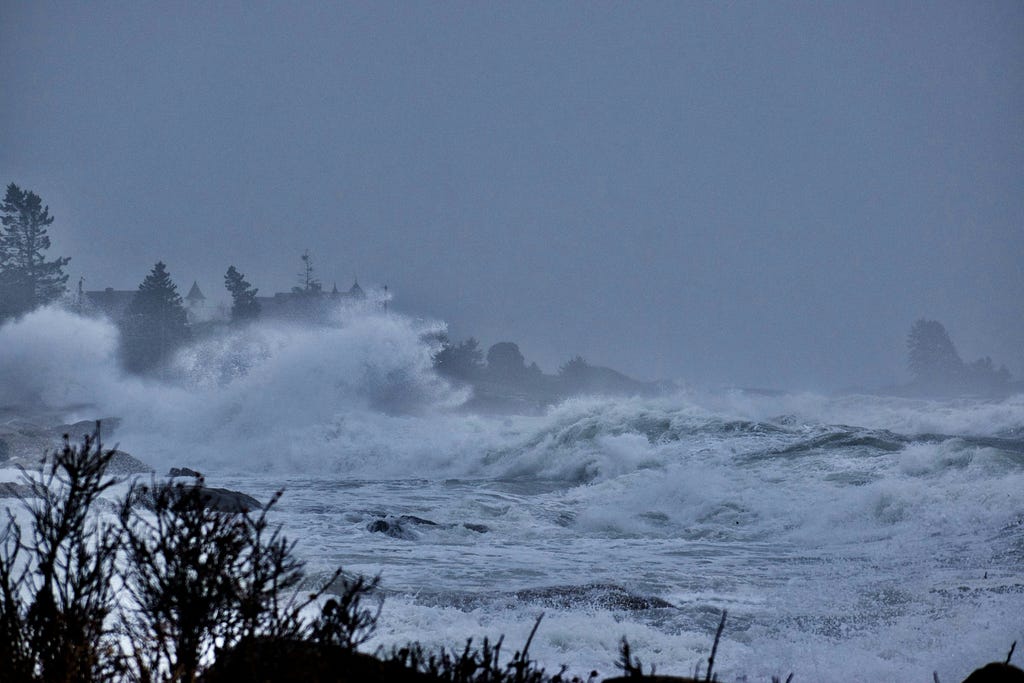 Voilent storm waves break on a seashore.