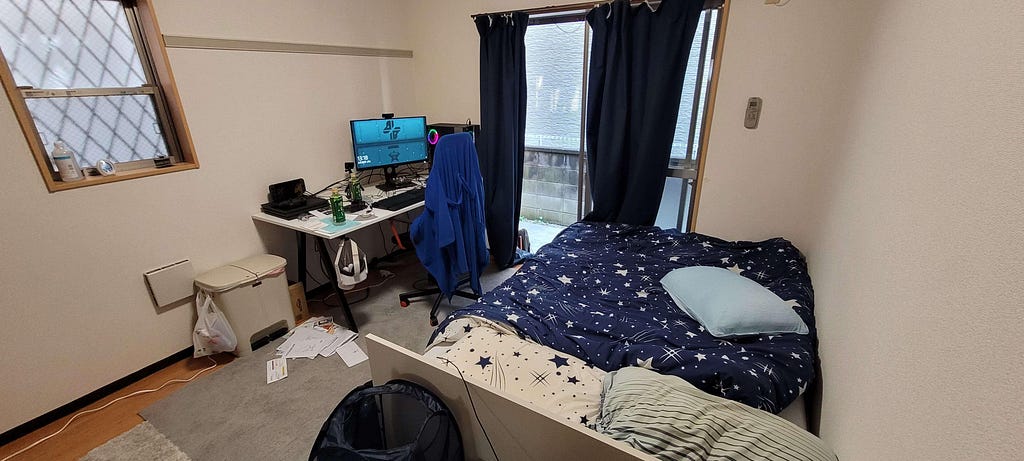 Queen bed, large desk, and finally some carpets