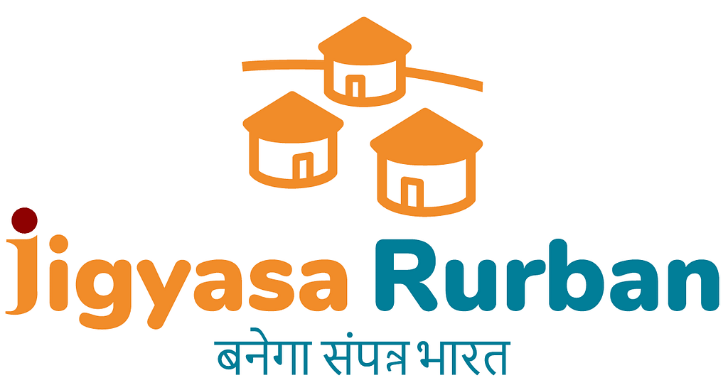 Jigyasa Rurban’s logo. Three simple huts drawn in orange with the text ‘Jigyasa Rurban’ in orange and blue underneath; followed by the tagline in Hindi — “India will become prosperous.’