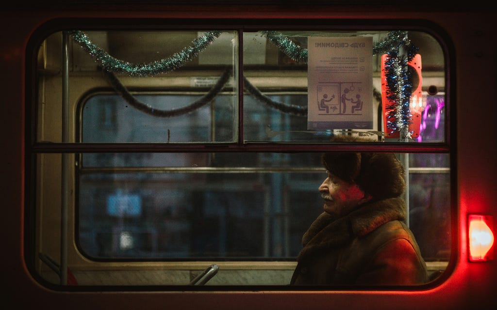 sad man sitting in a metro