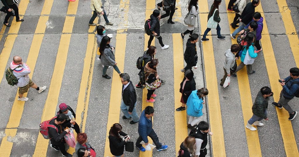 People crossing pedestrian lane