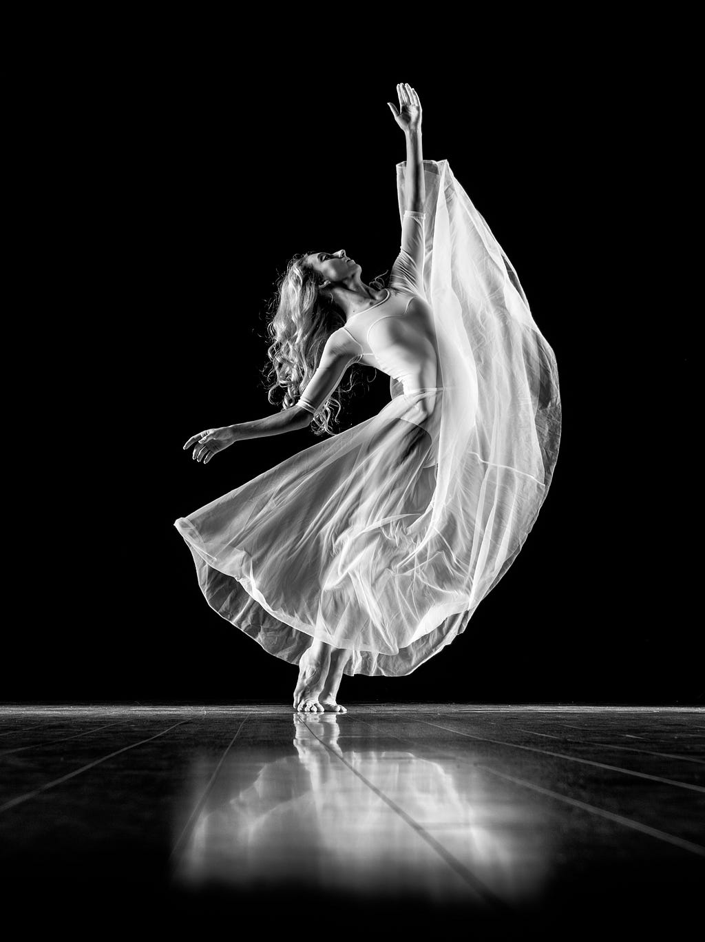 A black and white photo a ballerina.