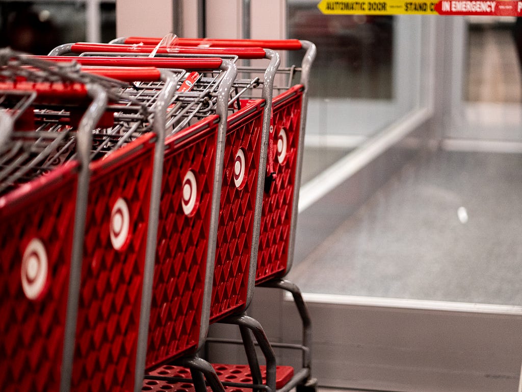 A line of red grocery carts from American retailer Target.