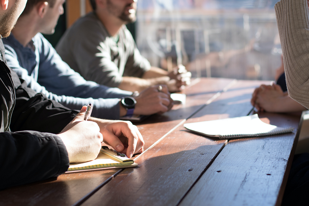 The web design begins with a discovery call or meeting to assess your company’s needs and goals. Photo by Dylan Gillis on Unsplash