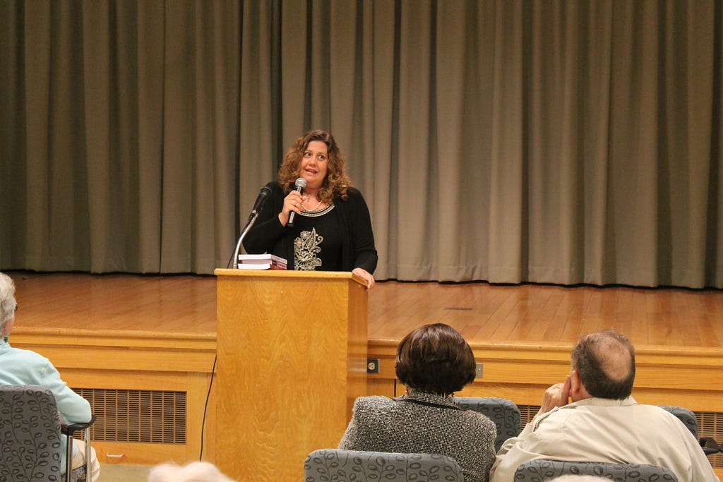 MATT SCHICKLING / WIRE PHOTO Abington author Wendy Tyson spoke to a group assembled at the auditorium at Rydal Park in Jenkintown on May 20. 