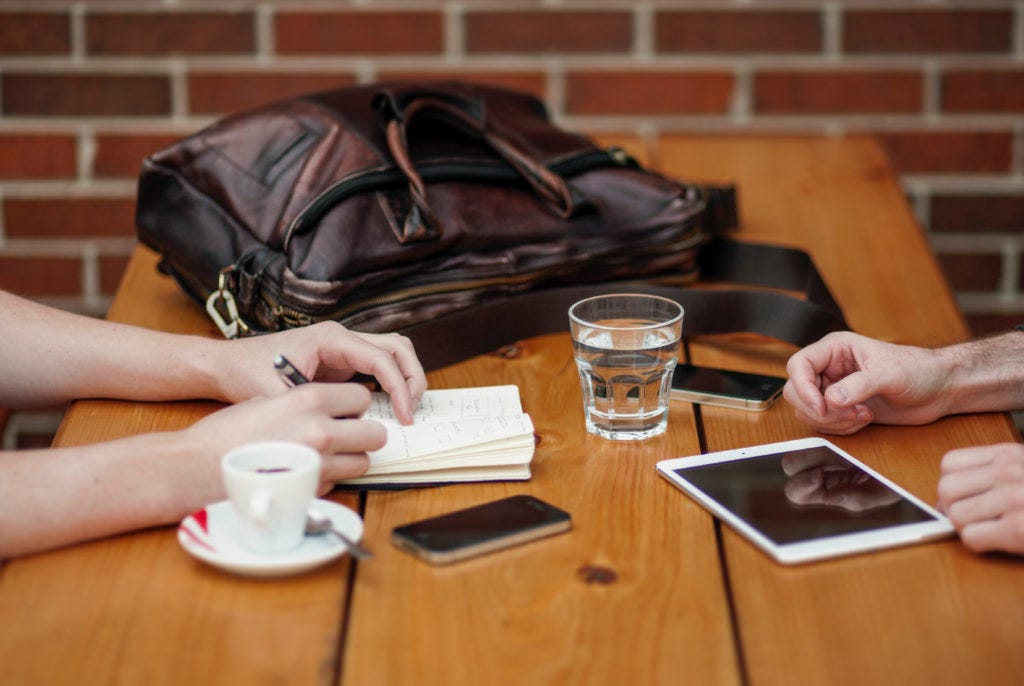 two-guys-having-a-meeting-in-a-coffee-shop