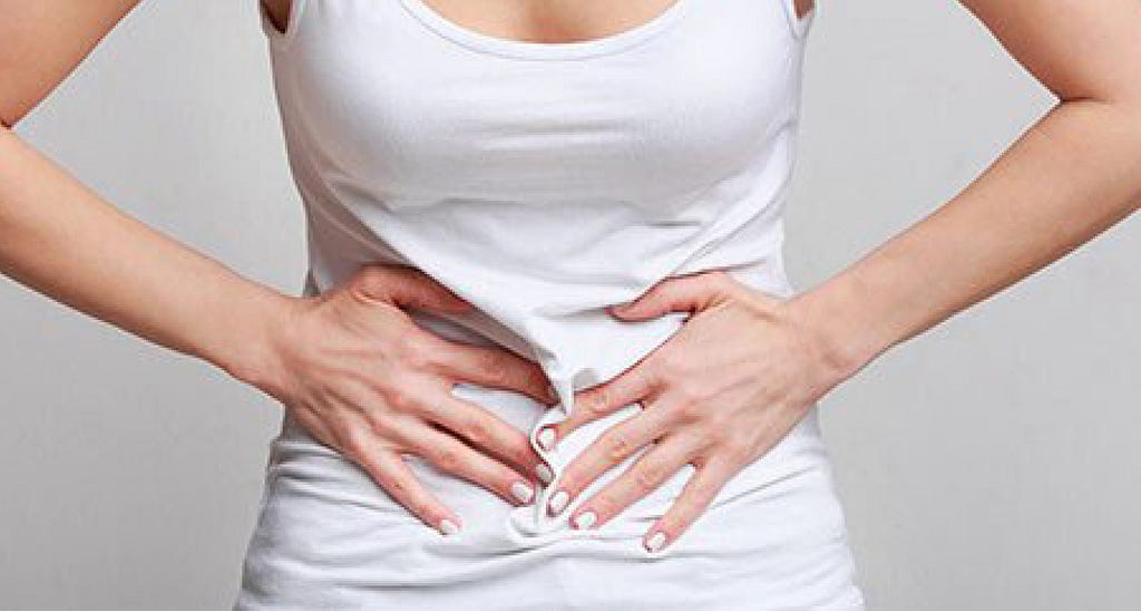 Woman with digestive issues and stomach pain