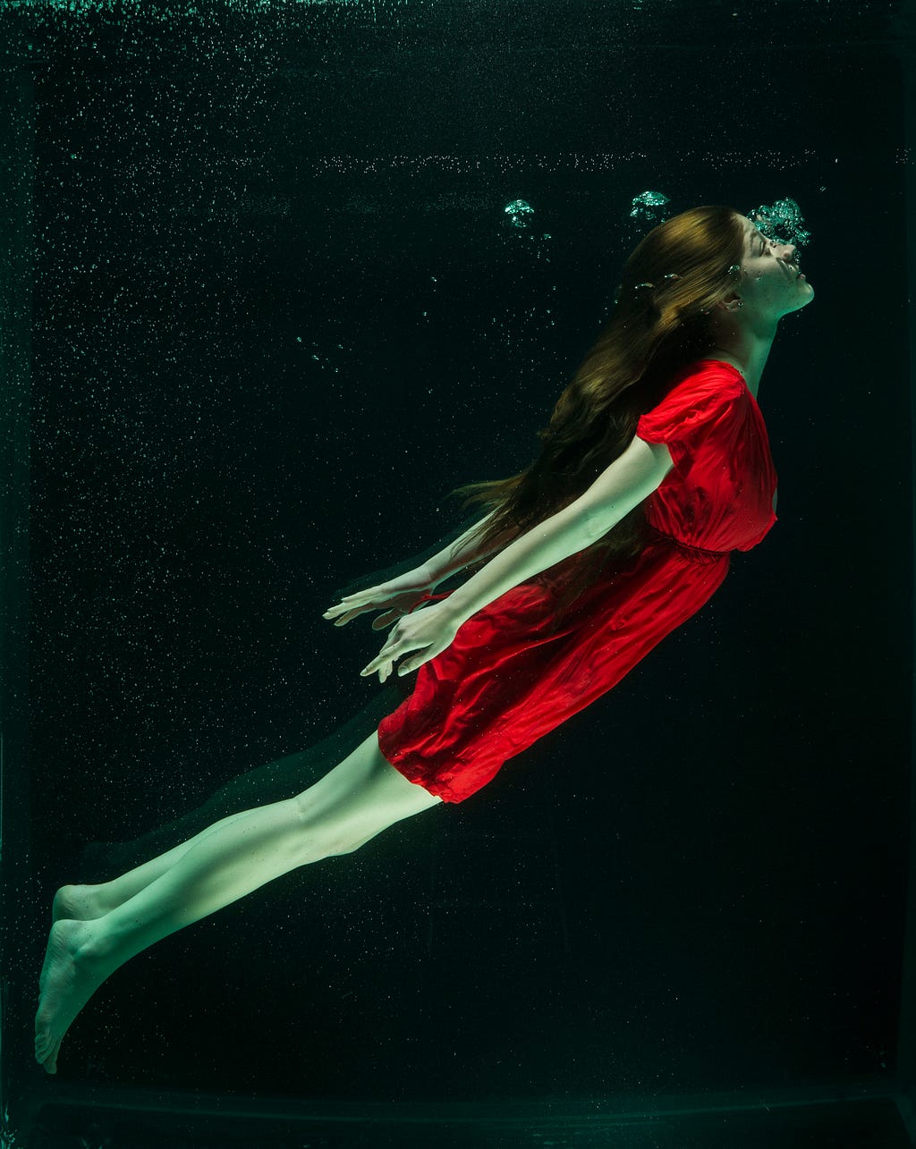 A dreamy picture of a woman dancing in the dark!