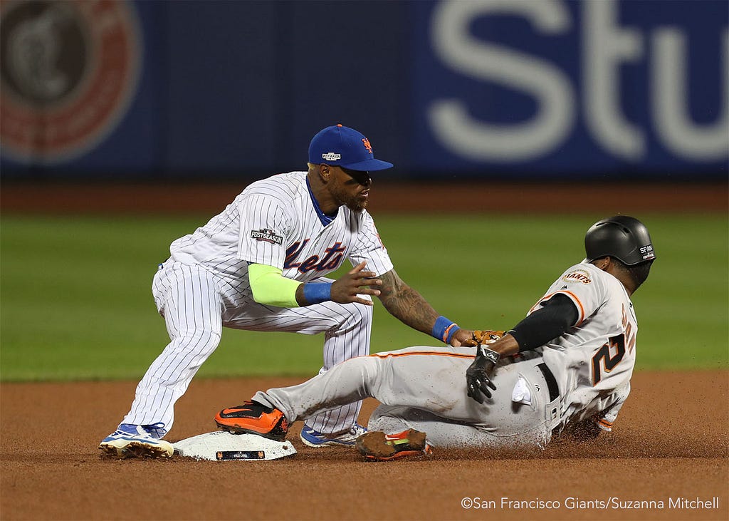 Jose Reyes tags out Denard Span attempting to steal second base in the fourth inning.