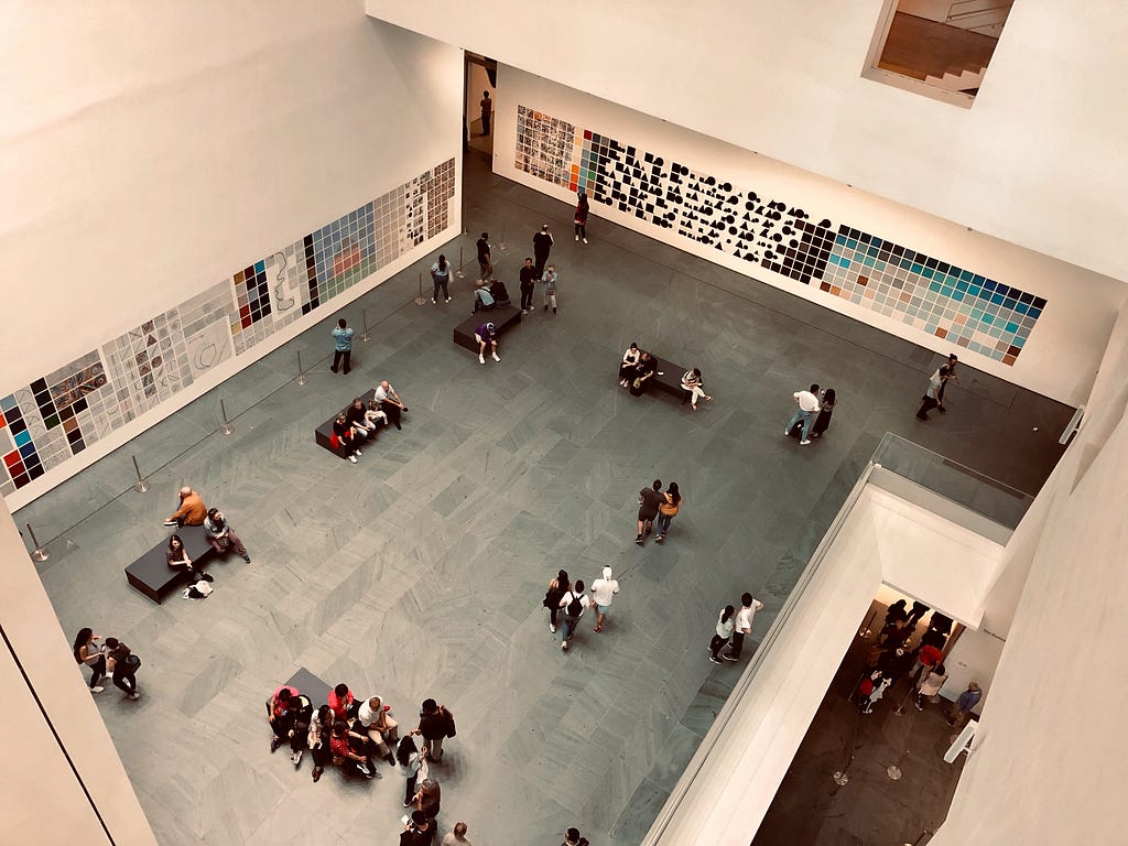 People loitering around a museum