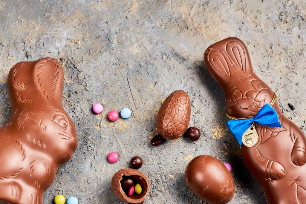 Two Chocolate Easter Bunny Eggs on a grey background — History of Easter