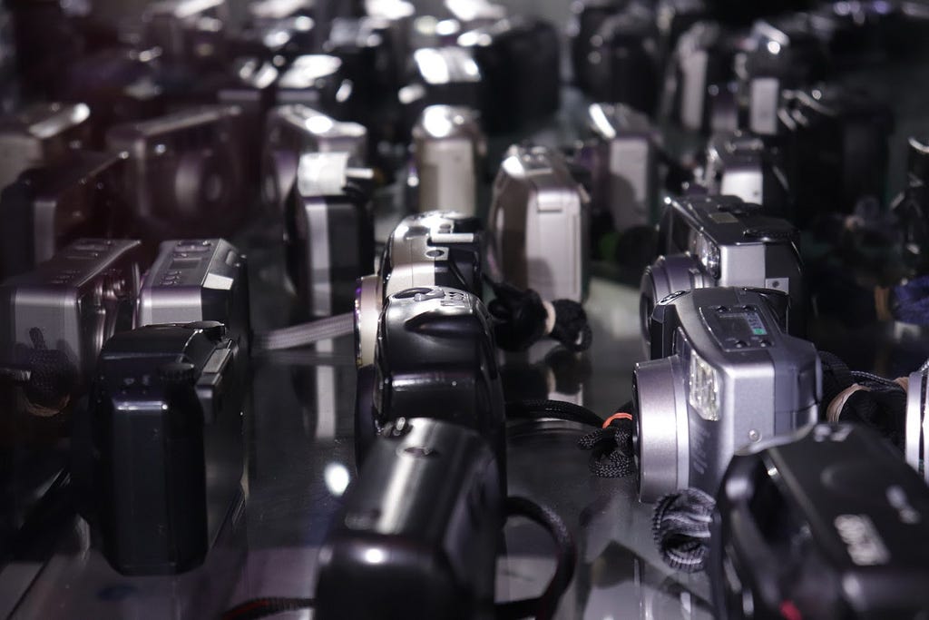 Rows of camera bodies in the Photodom store.