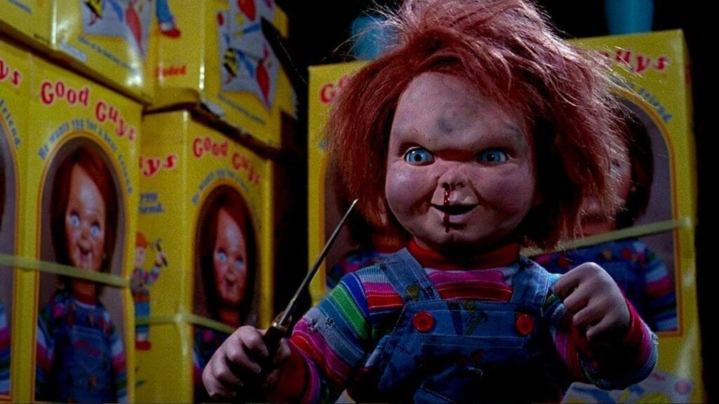 Chucky with a bloodied nose brandishing a knife