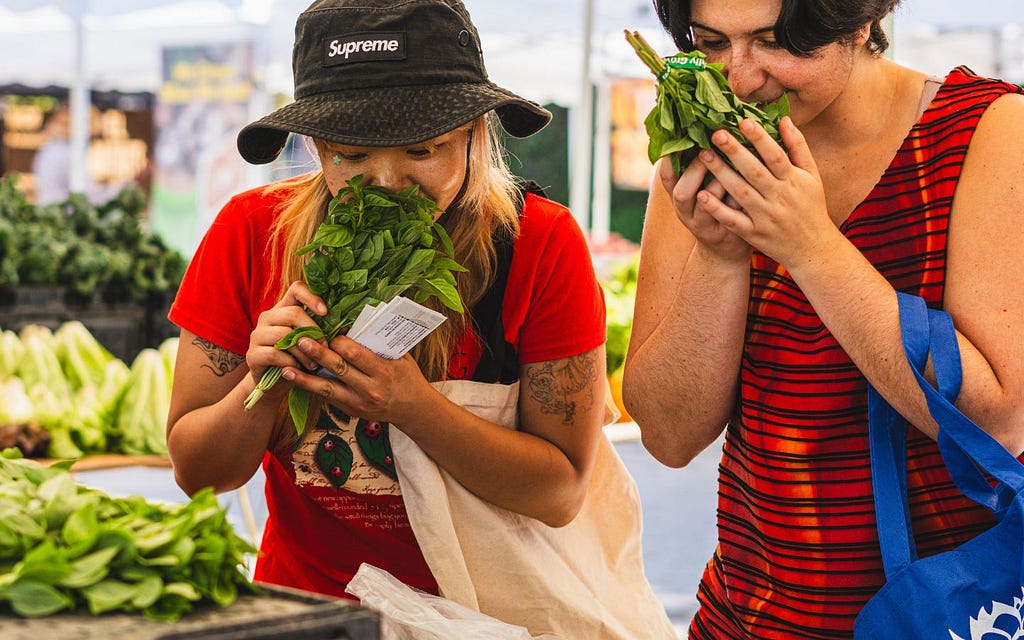 Two guests enjoying the freshness of the farmers market; video captures this better than any other medium