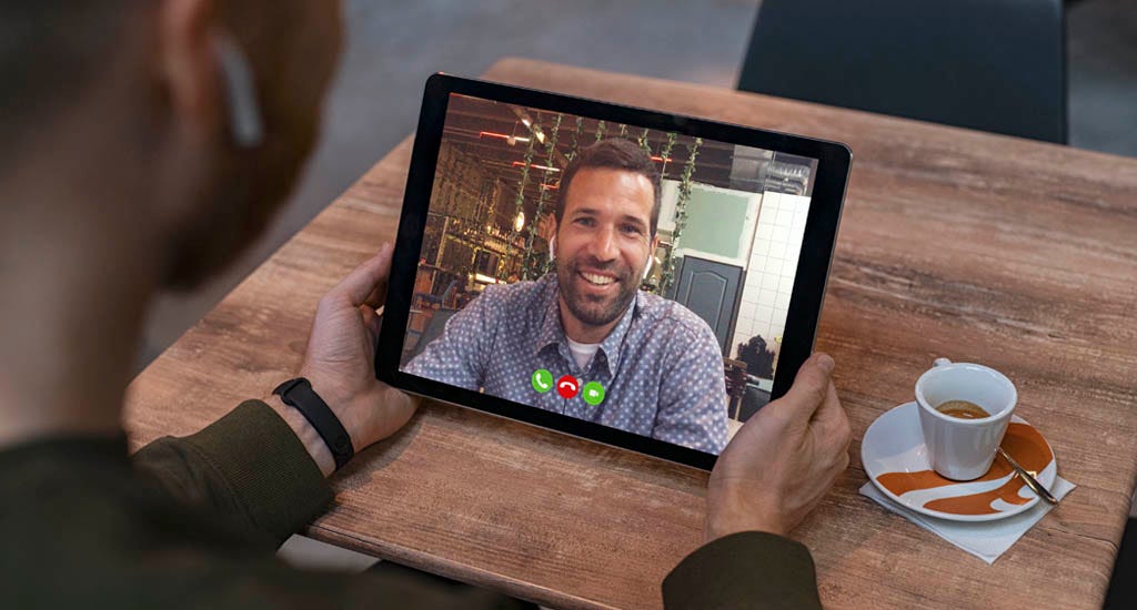 Two men on a virtual date through Skype