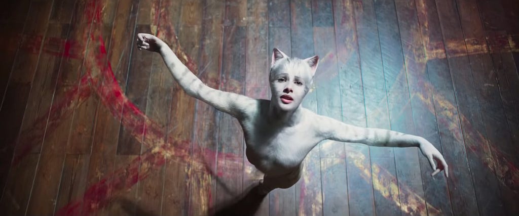 white cat dancing, arms outstretched