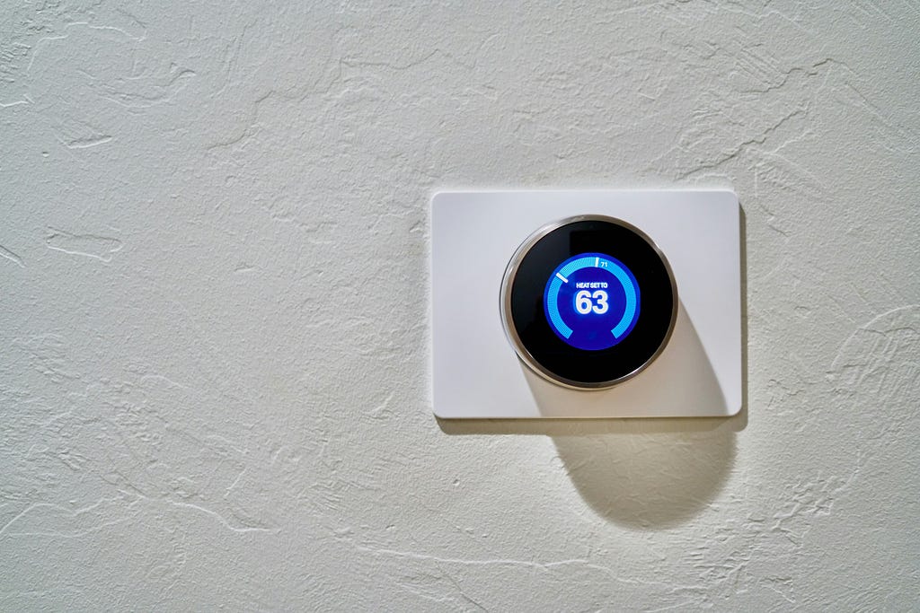 Image represent the programmable thermostats attached to a wall