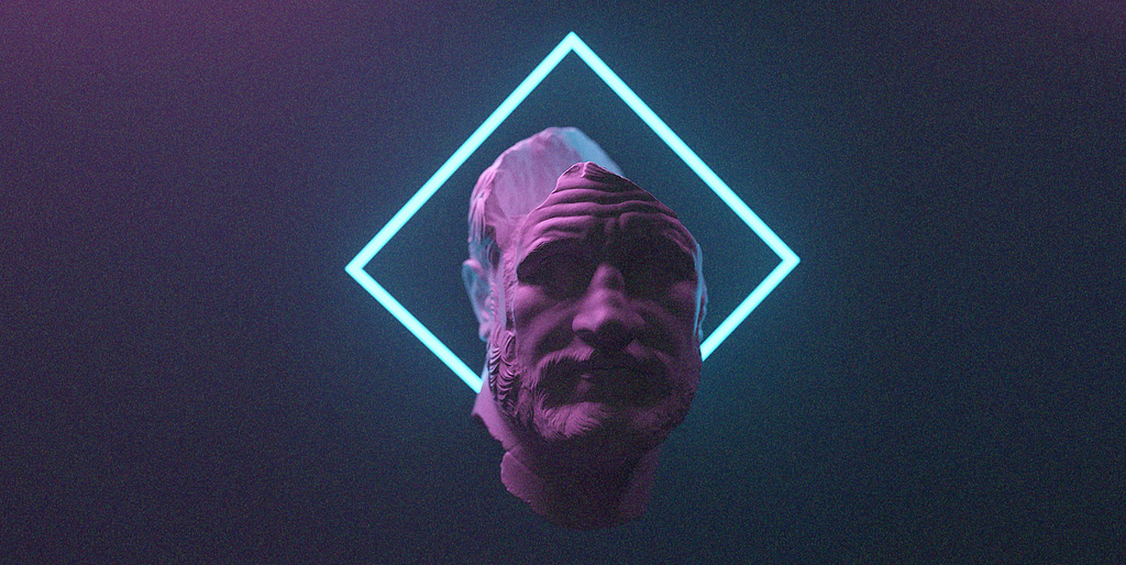 A foto de um filósofo em mármore, com um fundo azul e a foto está destacada com um losango ao fundo. O rosto demonstra uma pessoa pensativa.