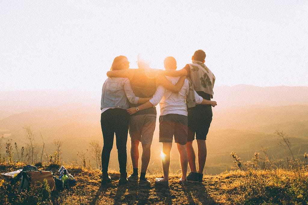 group of friends hugging each other