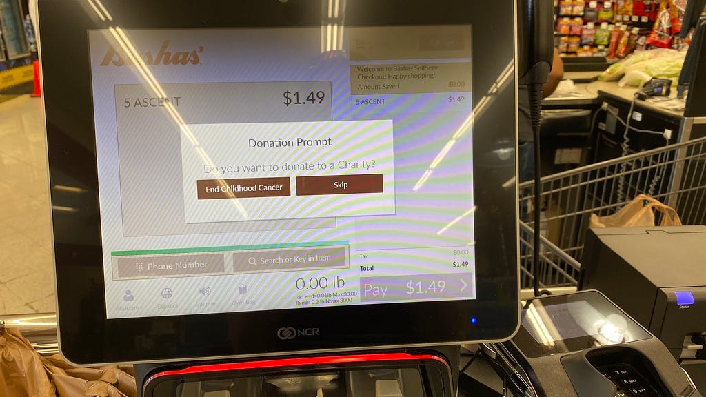 Self checkout machine from Bashas that asks if you would like to donate to charity