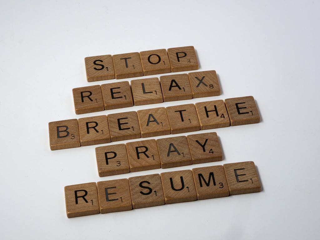 This image displays words made from Scrabble letters. The words are: stop, relax, breathe, pray, and resume.
