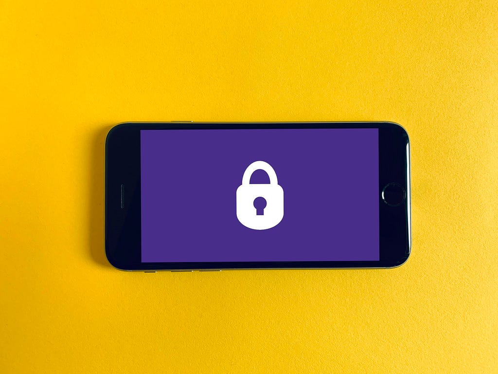 A phone screen showing a padlock, representing our SaaS guide to protecting customer data