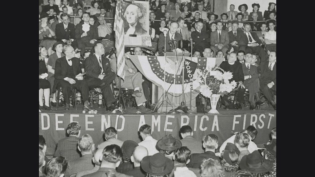 Images of nazi party in the US with the America First slogan