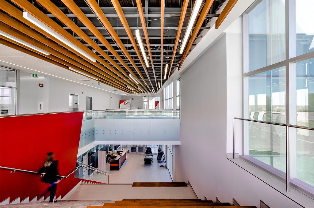 Woman going down stairs and helps to create a dynamic interior photograph at CCPV