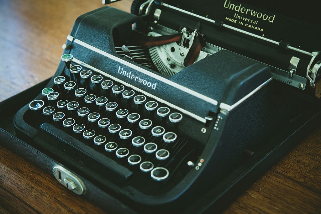 Typewriter on desk.