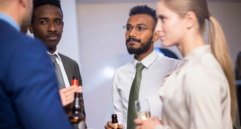 Group of business owners attending social mixer after hours