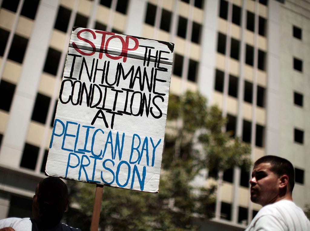 People attend a rally in Los Angeles in support of California inmates who spent weeks on a hunger strike.