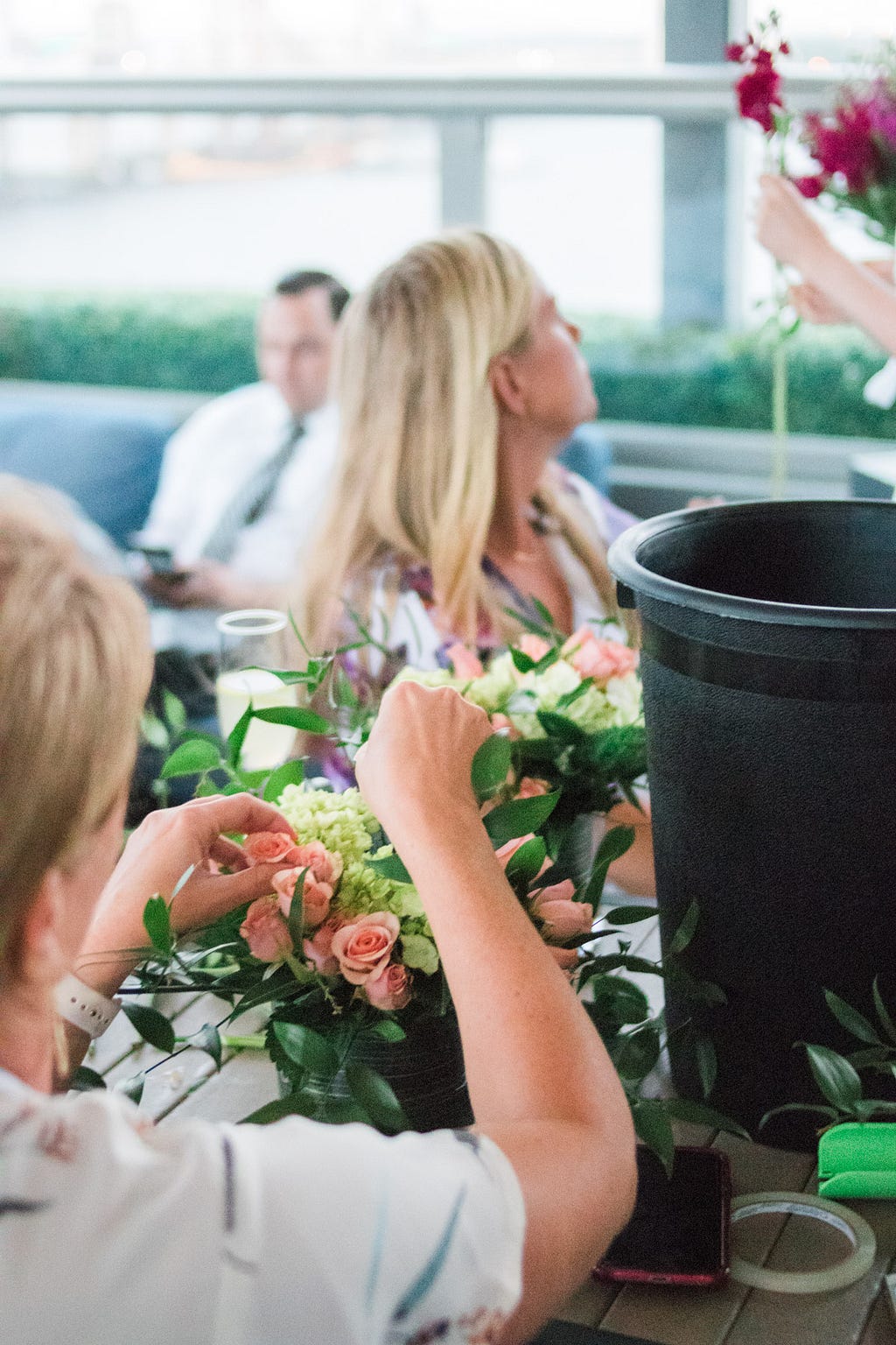 women making flower arrangements during Alice's Table workshop in Jacksonville, Florida