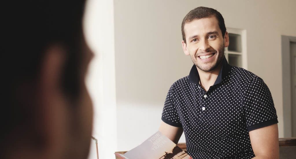 Man addressing non-binary coworker