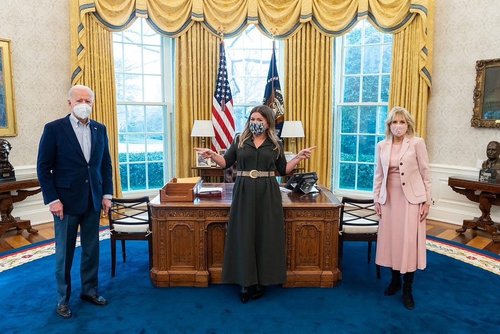 President Joe Biden and First Lady Jill Biden pose for photos with Kelly Clarkson on Feb. 20, 2021, in the Oval Office of the White House.