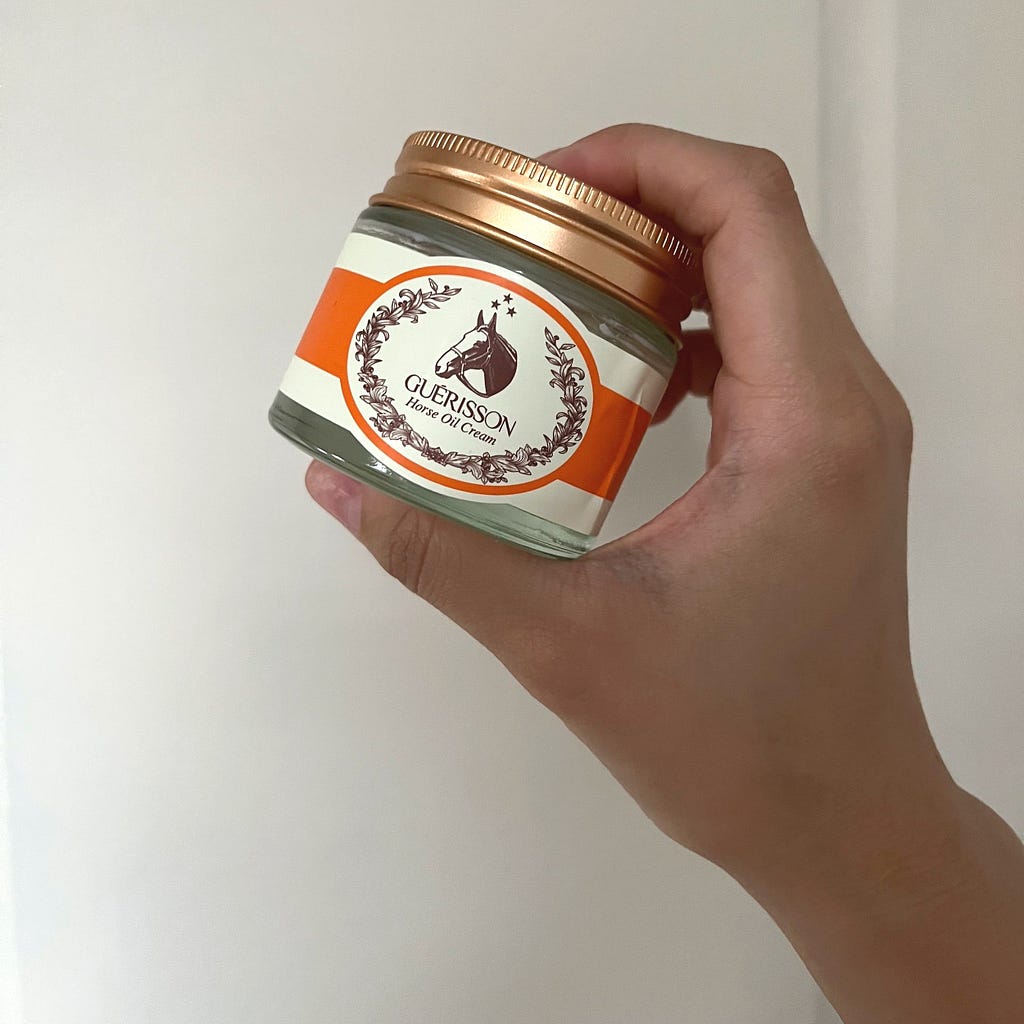 Rose gold cover top for clear jar with orange and light beige white sticker with horse logo