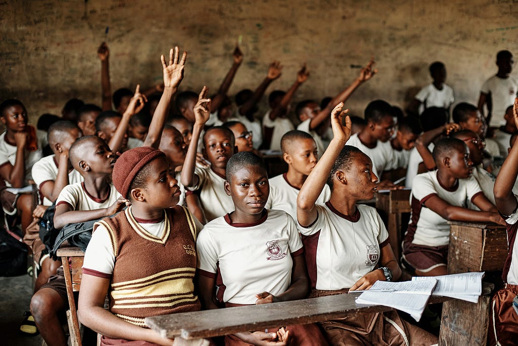 Nigerian secondary school students learning during a class