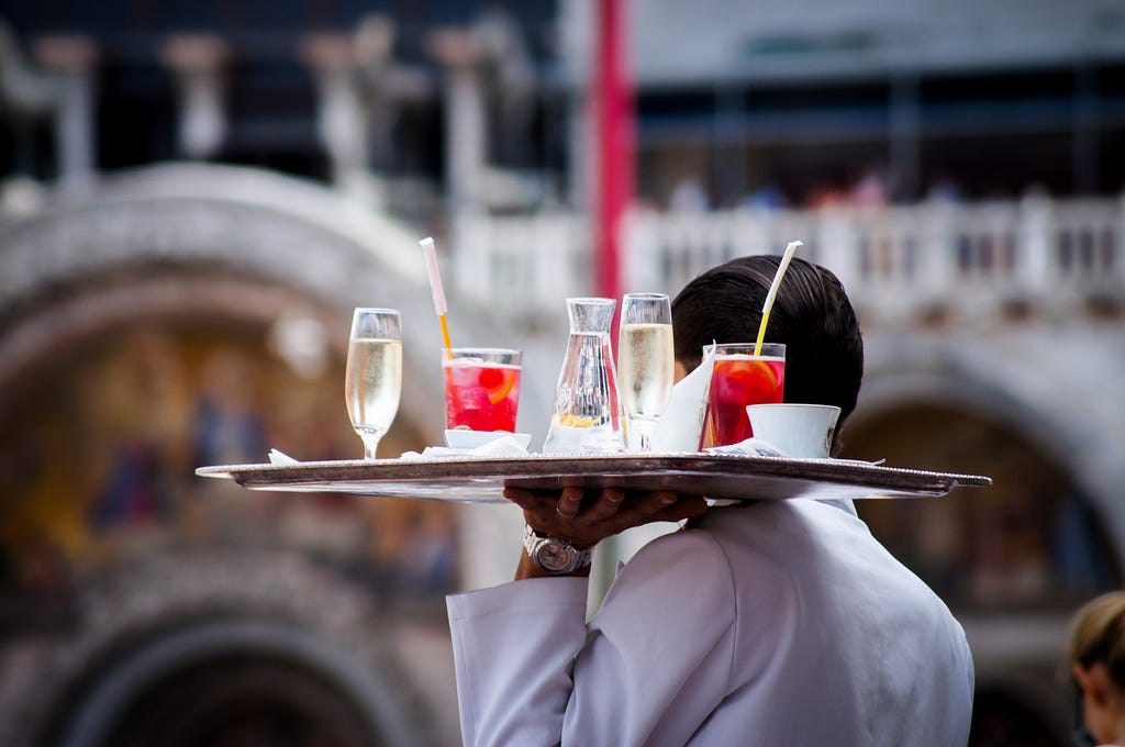 A student doing weekend job as a bar server