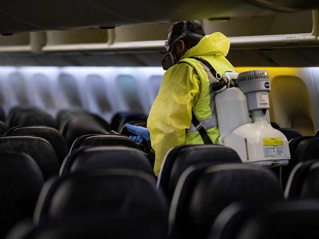 Airport staff disinfects an airplane.