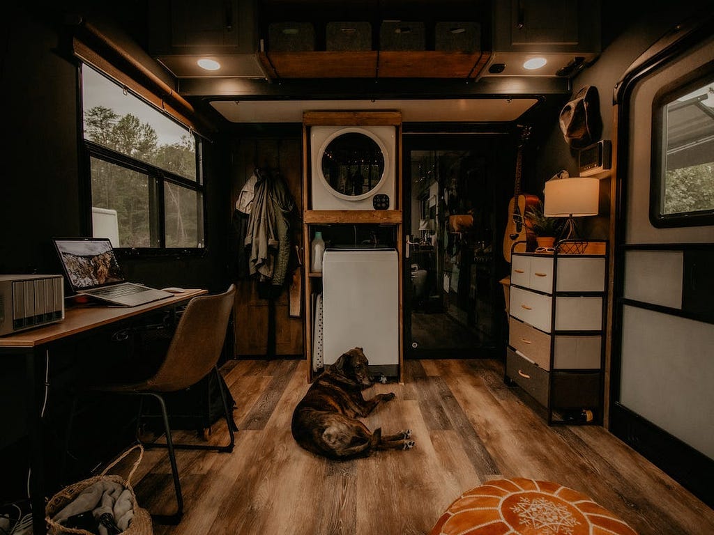 The RV features an electric fireplace, a washer and dryer, and 1 1/2 bathrooms.