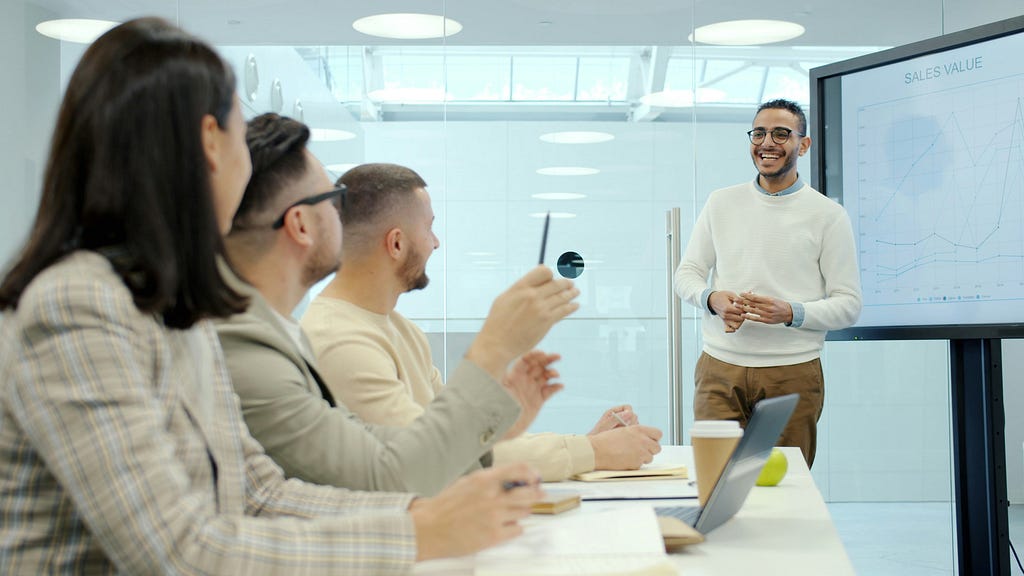 Business people in an office, representing the finance and business audience sector