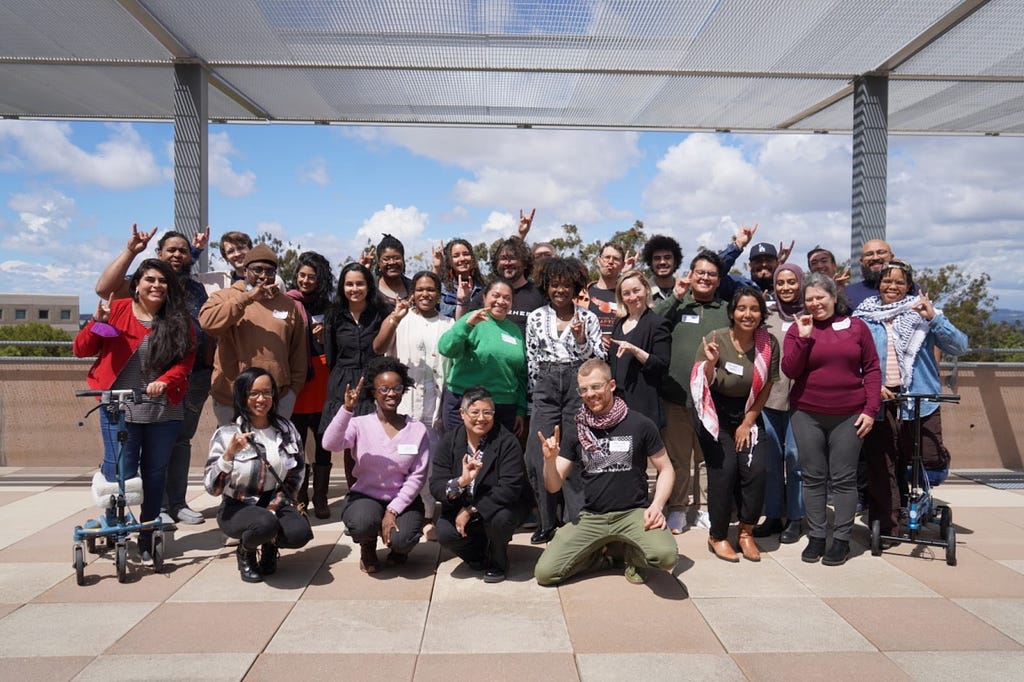 Group picture of event participants on the roof of Donald Bren Hall, located on the campus of the University of California, Irvine.